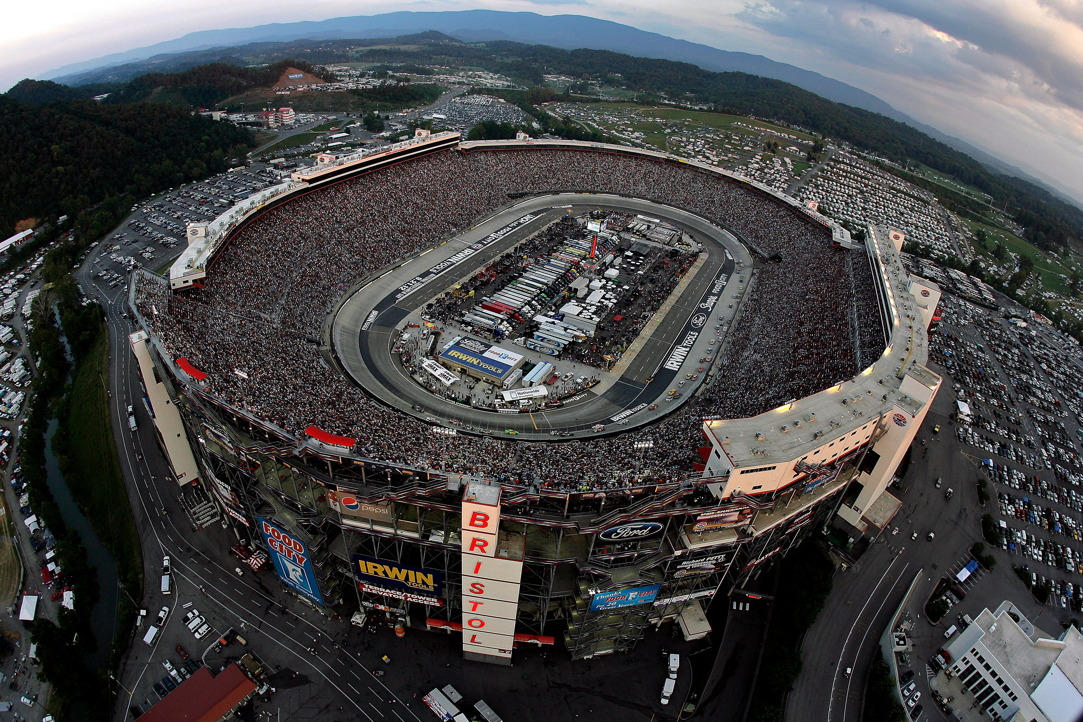 BRISTOL, TN - AUGUST 25: Cars race during the NASCAR Sprint Cup Series IRWIN Tools Night Race at Bristol Motor Speedway on August 25, 2012 in Bristol, Tennessee. (Photo by Andrew Coppley - Pool/Getty Images for NASCAR) | Getty Images