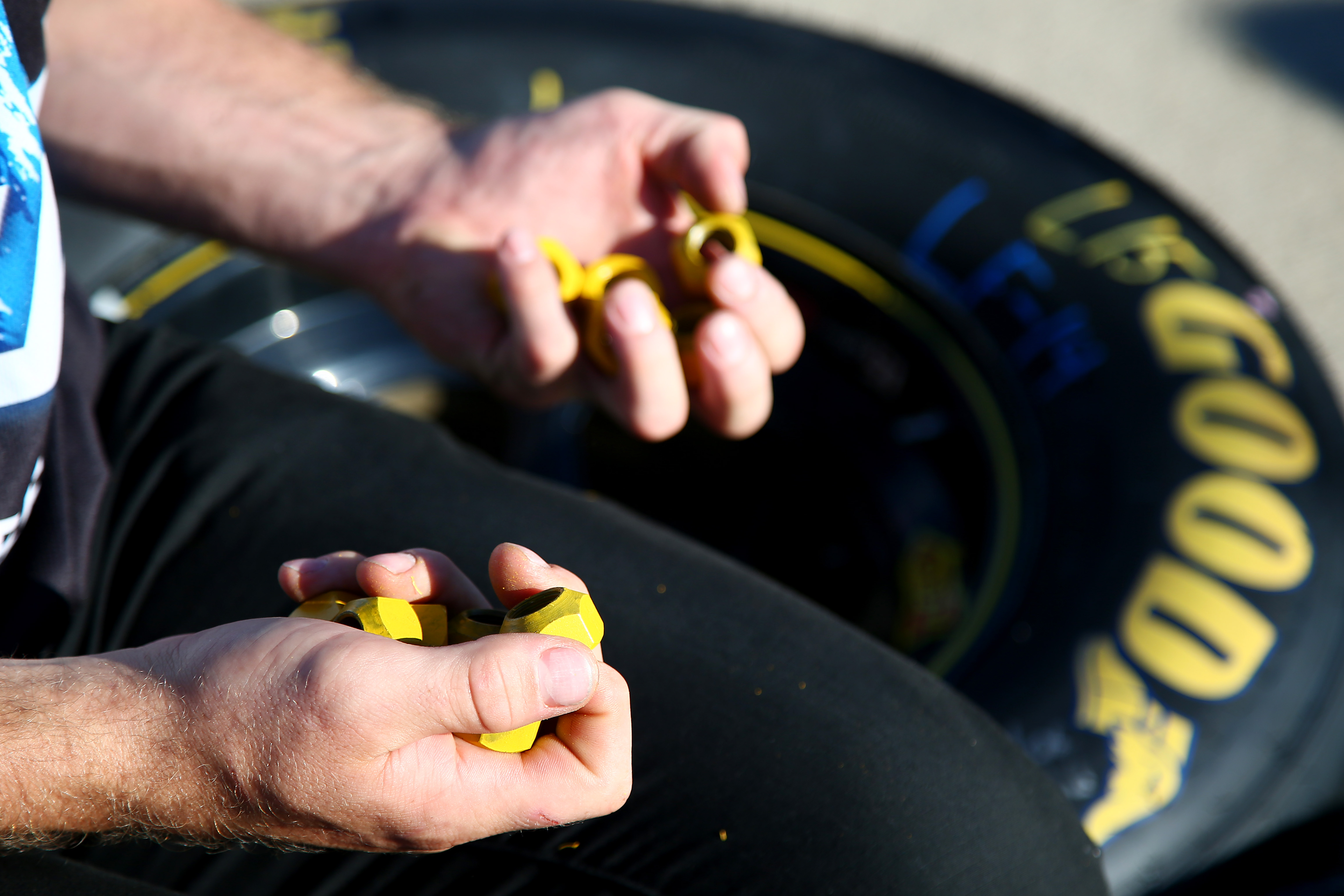 JOLIET, IL - SEPTEMBER 18: Detail view of lugnuts being put on a tire prior the NASCAR Sprint Cup Series Teenage Mutant Ninja Turtles 400 at Chicagoland Speedway on September 18, 2016 in Joliet, Illinois. (Photo by Sarah Crabill/Getty Images) | Getty Images