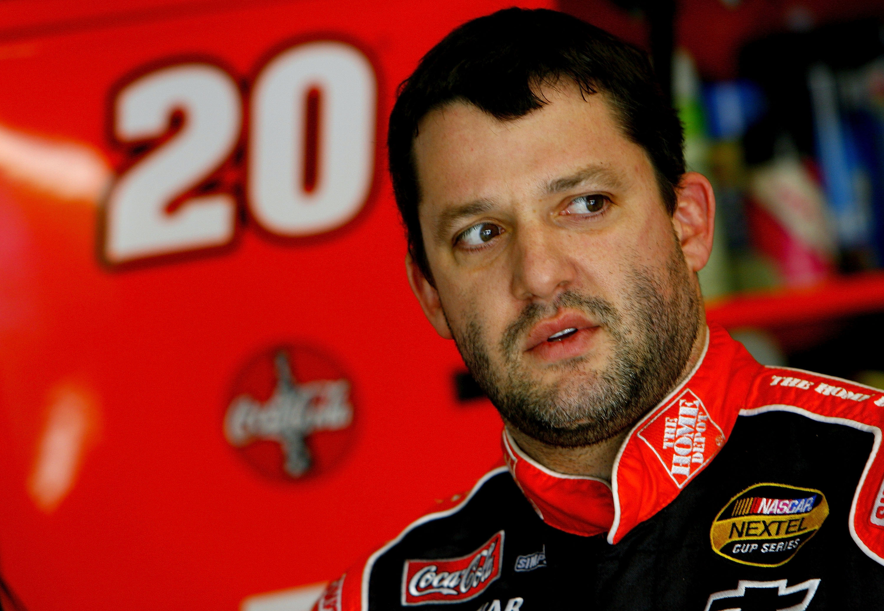 LAS VEGAS - JANUARY 29: Tony Stewart, driver of the #20 Home Depot Chevrolet, in the garage during NASCAR testing at Las Vegas Motor Speedway January 29, 2007 in Las Vegas, Nevada. (Photo by Rusty Jarrett/Getty Images for NASCAR) | Getty Images